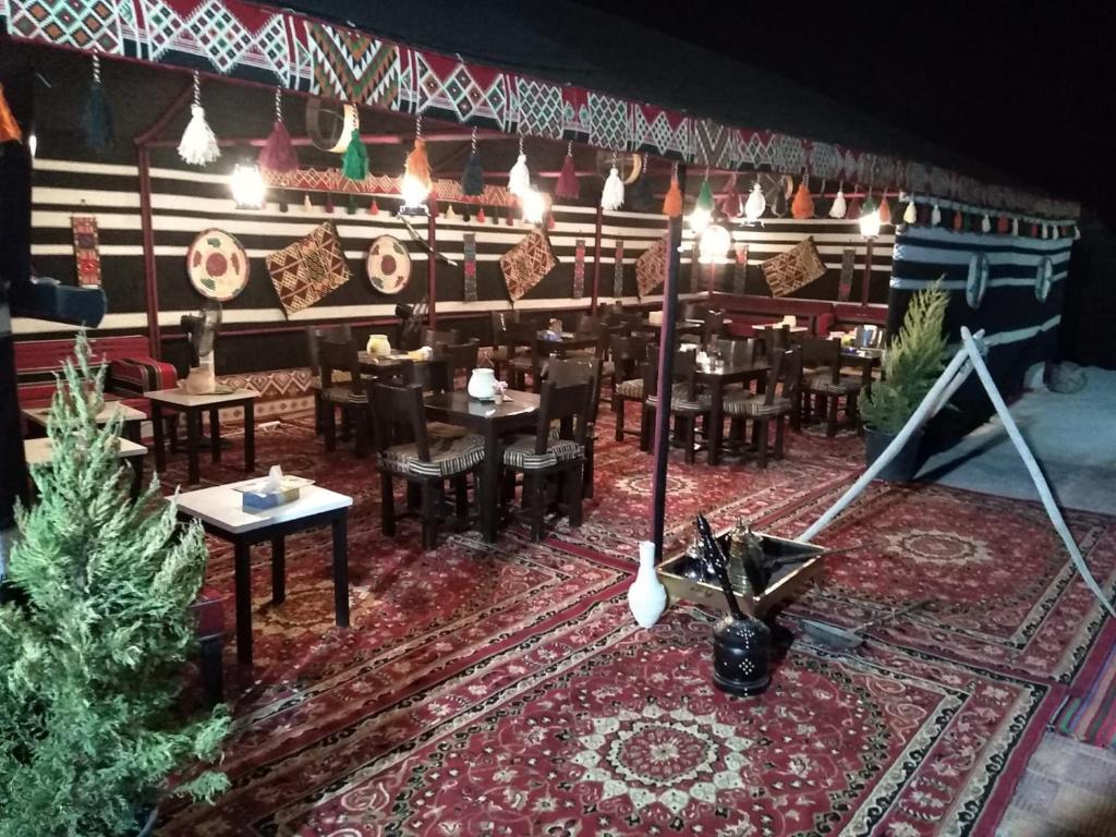 a dining room with christmas trees and christmas decorations at Farmer stay hostel in Wadi Musa