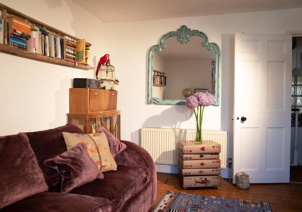 a living room with a couch and a mirror at Birch in the Lanes in Brighton & Hove