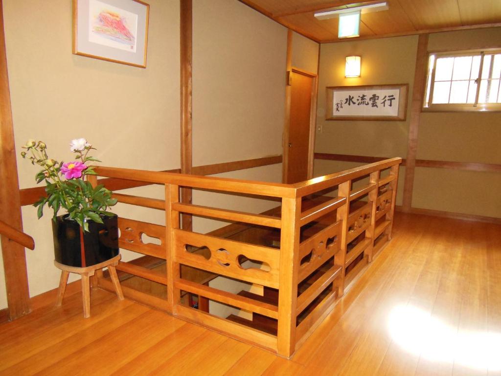 Postel nebo postele na pokoji v ubytování Tsutaya Ryokan