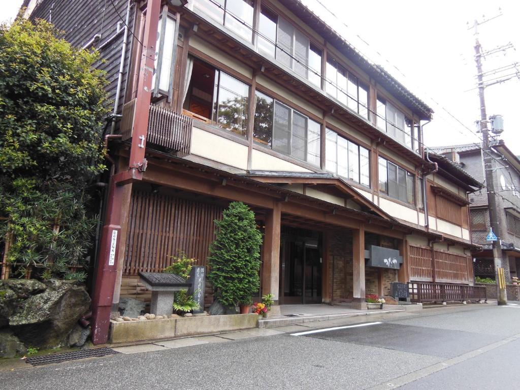 a building on the side of a street at Tsutaya Ryokan in Toyooka