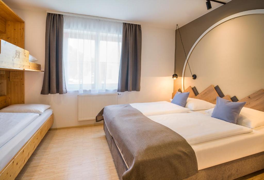 Posteľ alebo postele v izbe v ubytovaní JUFA Hotel Wipptal