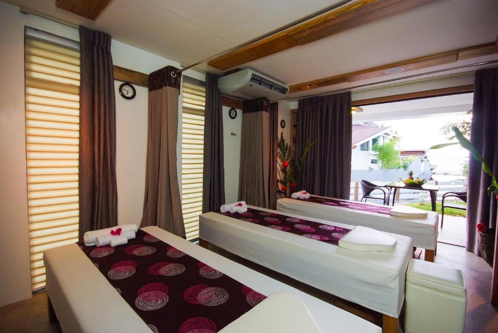 Postel nebo postele na pokoji v ubytování Infinity Resort