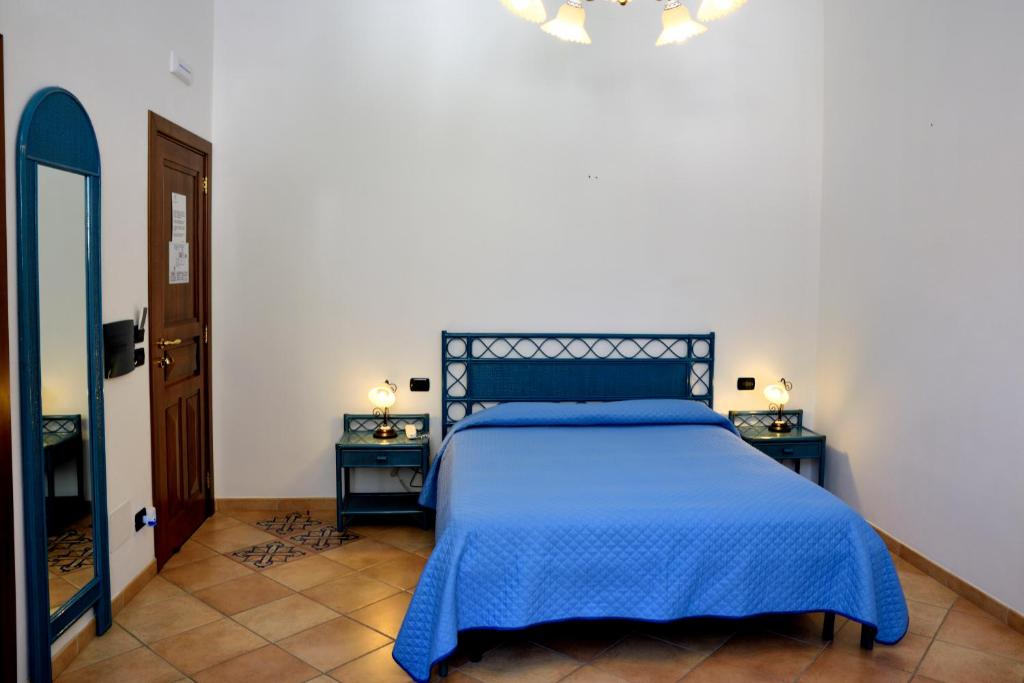 Postel nebo postele na pokoji v ubytování Hotel Principe di Rinella