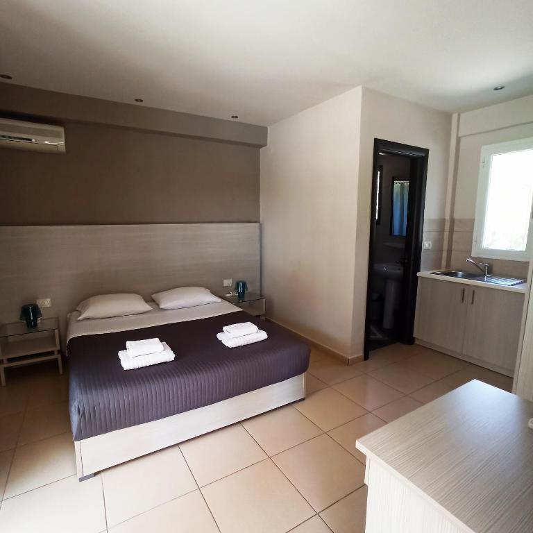 Postel nebo postele na pokoji v ubytování Trianon Studios