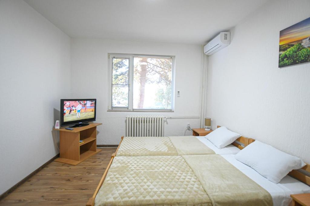 Postel nebo postele na pokoji v ubytování Apartman 59