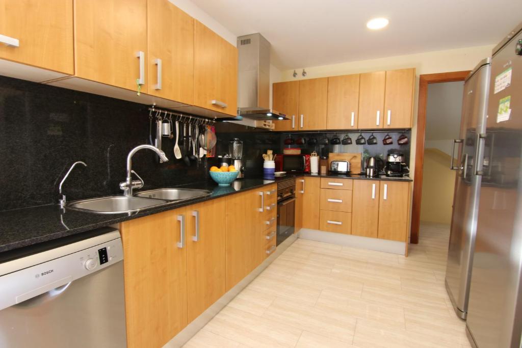 A kitchen or kitchenette at Stay U-nique Villa Portimar
