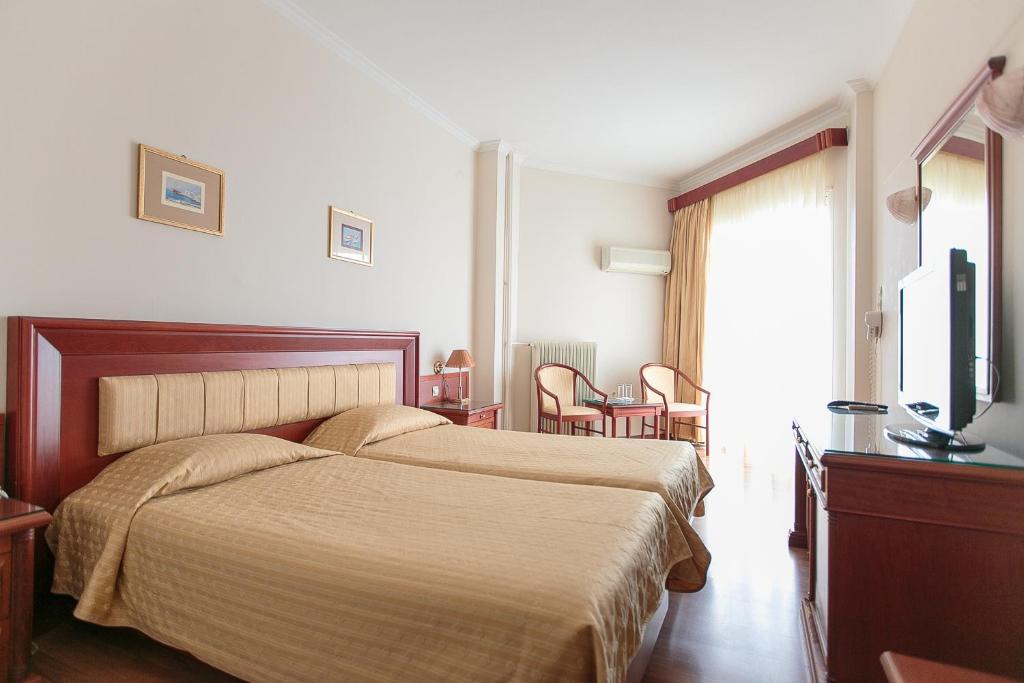 Postel nebo postele na pokoji v ubytování Tzaki hotel & restaurant Patras