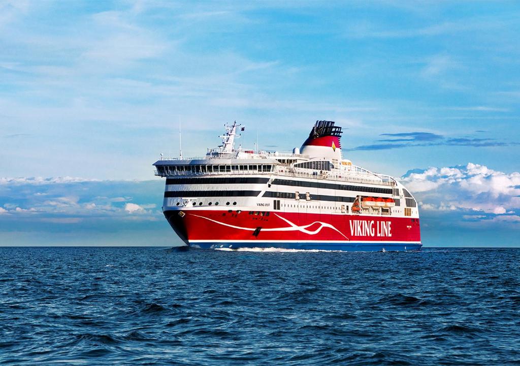 a large red and white cruise ship in the ocean at Viking Line ferry Viking XPRS - One-way journey from Helsinki to Tallinn in Helsinki