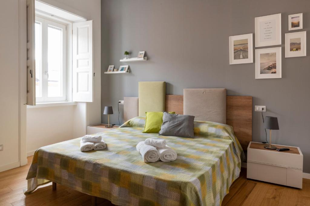 A bed or beds in a room at Mastu Gilardo