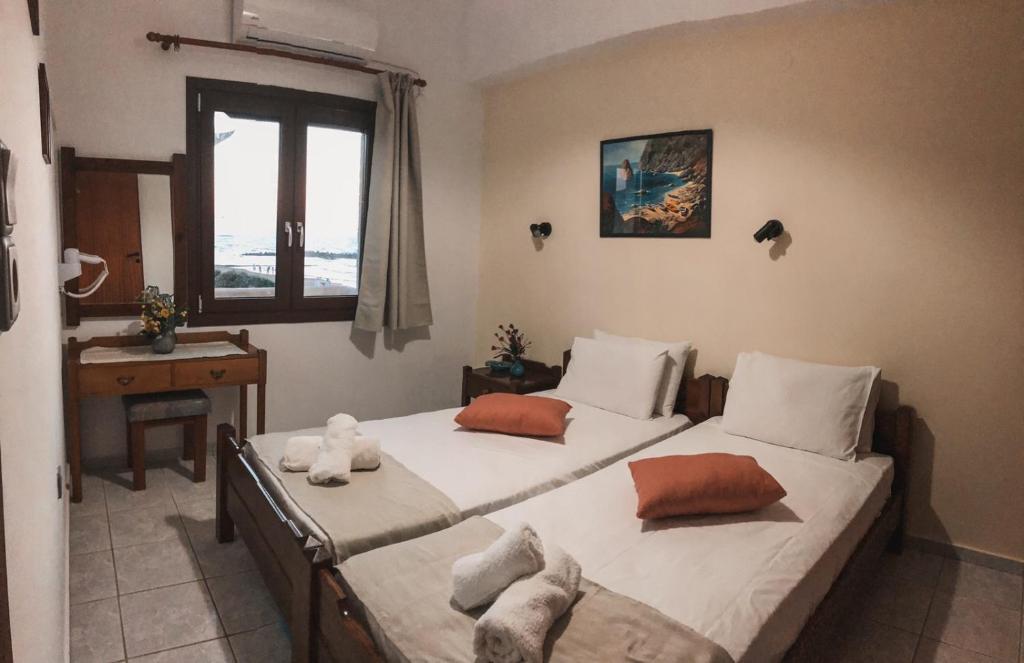 Postel nebo postele na pokoji v ubytování Anthoula Apartments