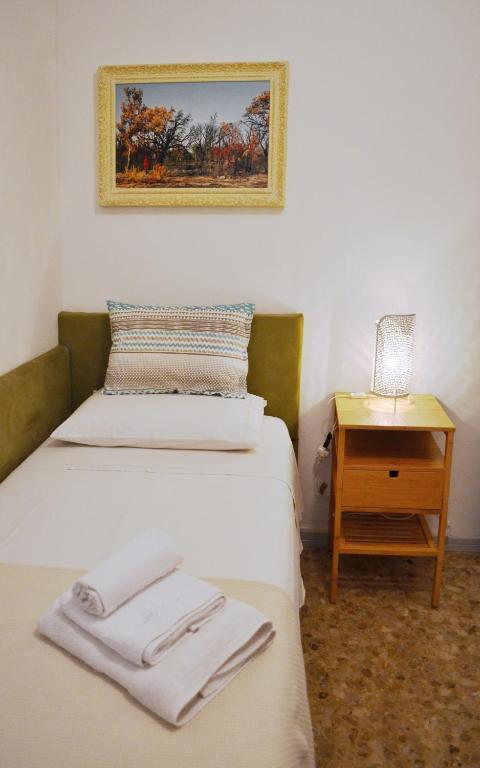 Postel nebo postele na pokoji v ubytování Da Virginia B&B
