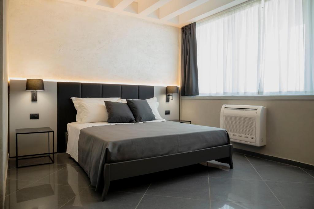 Łóżko lub łóżka w pokoju w obiekcie Tranquillo UpTown Lecce