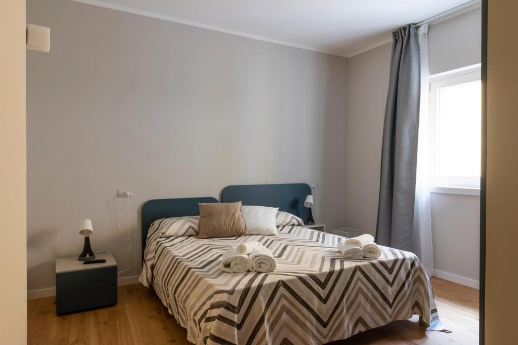 A bed or beds in a room at Mastu Gilardo