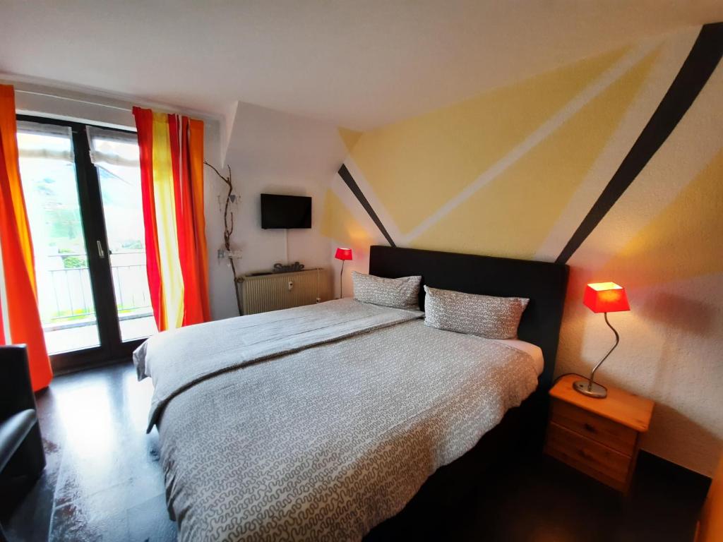 Postel nebo postele na pokoji v ubytování Gästehaus Moselblick