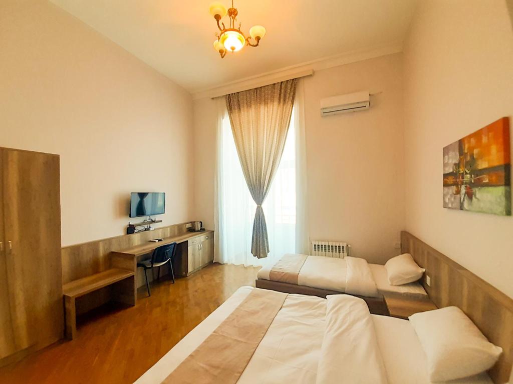 Ένα ή περισσότερα κρεβάτια σε δωμάτιο στο Liman Hotel Baku
