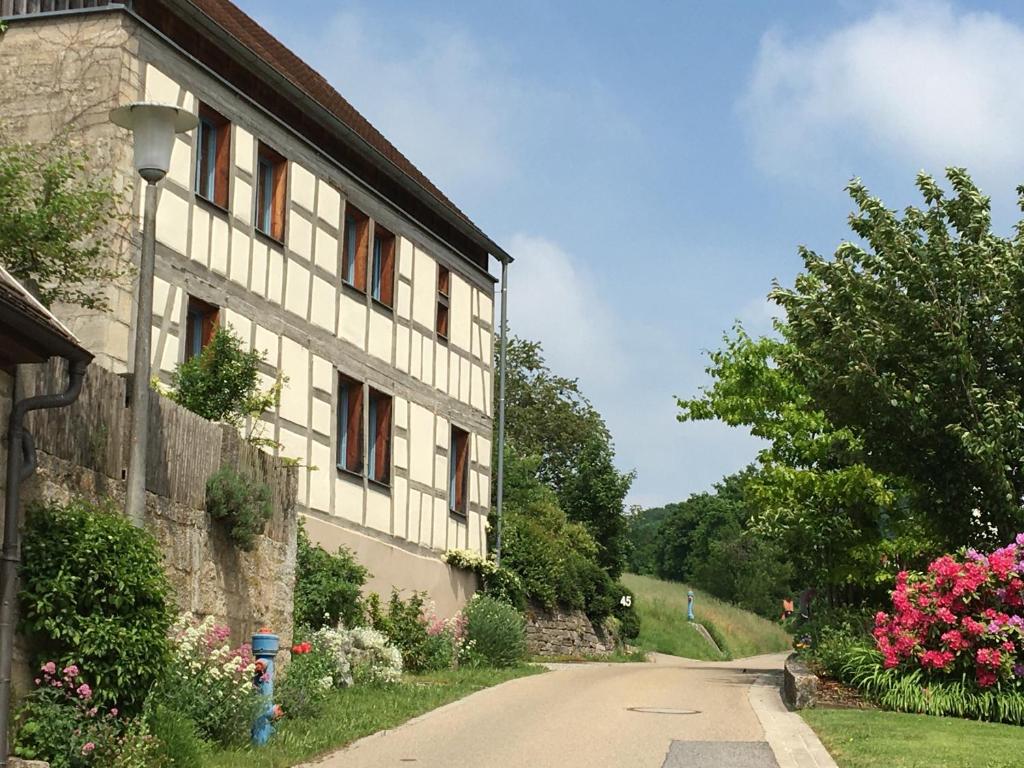 a house on the side of a road at Rose Cottage im romantischen Taubertal in Adelshofen