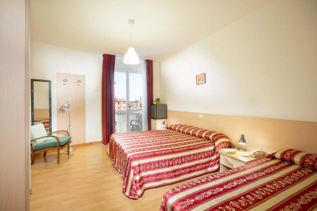 Postel nebo postele na pokoji v ubytování Hotel Palladio