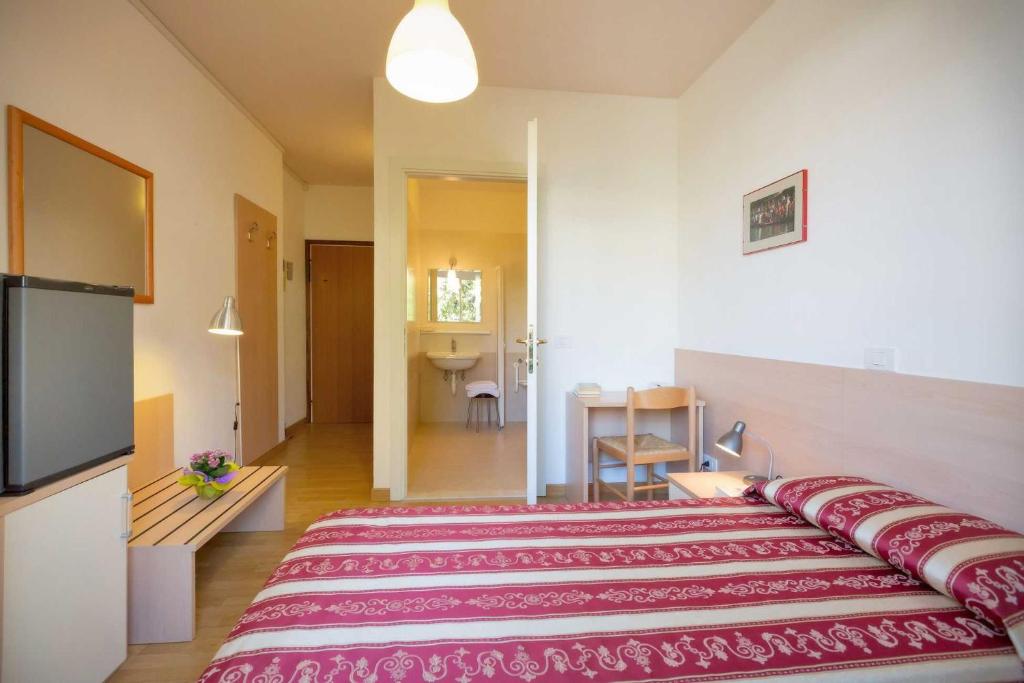 Postel nebo postele na pokoji v ubytování Hotel Palladio