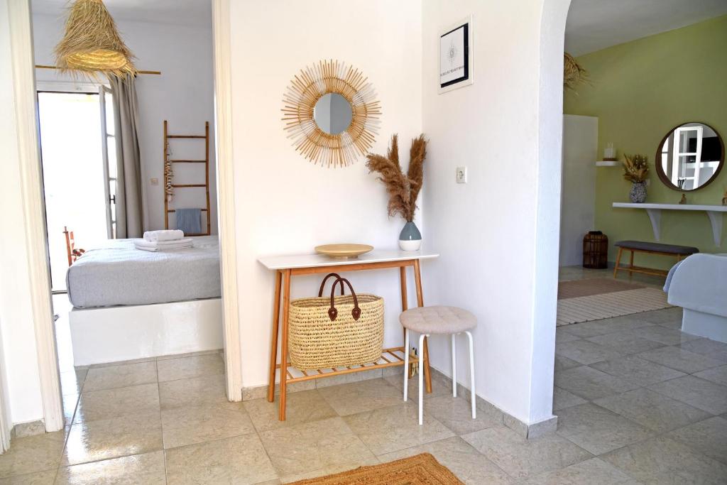 A bed or beds in a room at Nefeli Suites Kythnos