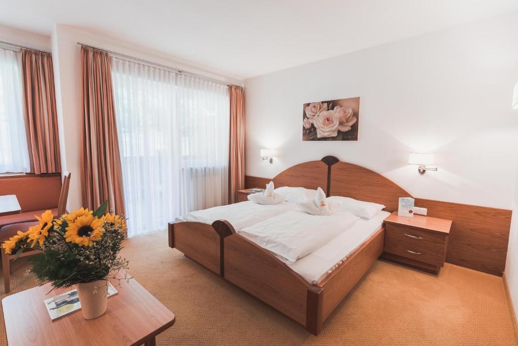 Postel nebo postele na pokoji v ubytování Hotel Am Sonneck
