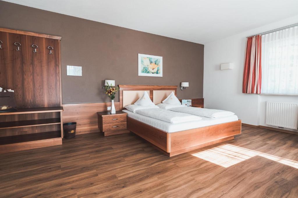 Postel nebo postele na pokoji v ubytování Hotel Am Sonneck