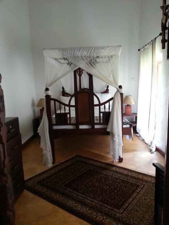 Postel nebo postele na pokoji v ubytování Hiliki House
