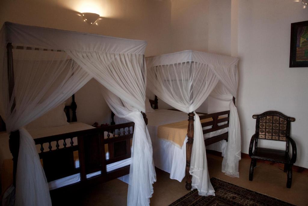 Postel nebo postele na pokoji v ubytování Hiliki House