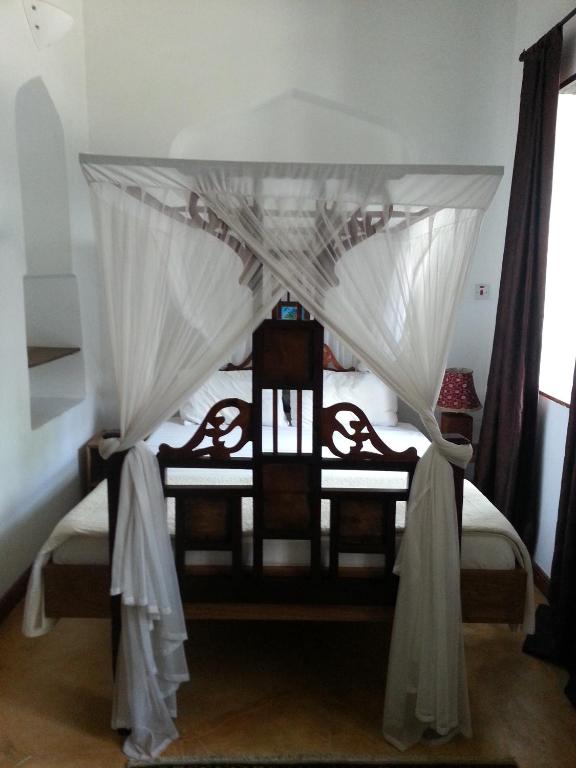 Postel nebo postele na pokoji v ubytování Hiliki House