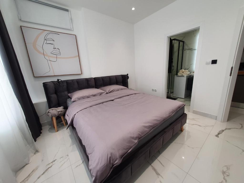 Postel nebo postele na pokoji v ubytování Apartmani Lavin