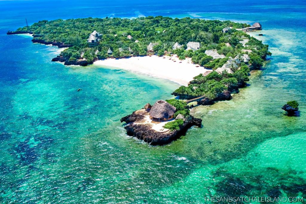an island in the ocean with a white beach at Chale Island Resort in Chale Island