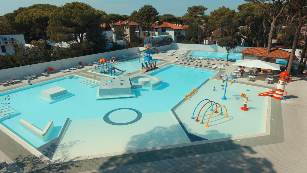 an overhead view of a large swimming pool with a water park at Sona Mobilhome M in Lido di Spina