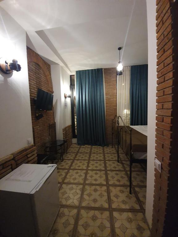 Postel nebo postele na pokoji v ubytování Janashia Boutique Hotels