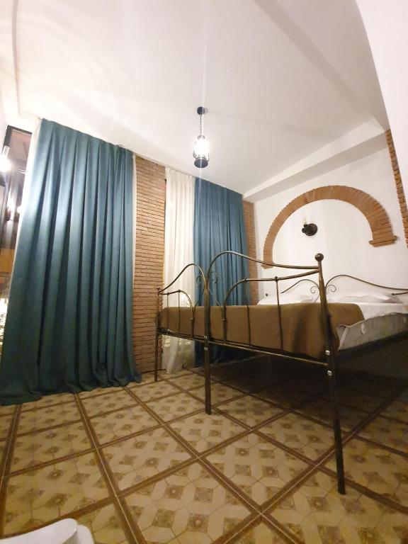 Postel nebo postele na pokoji v ubytování Janashia Boutique Hotels