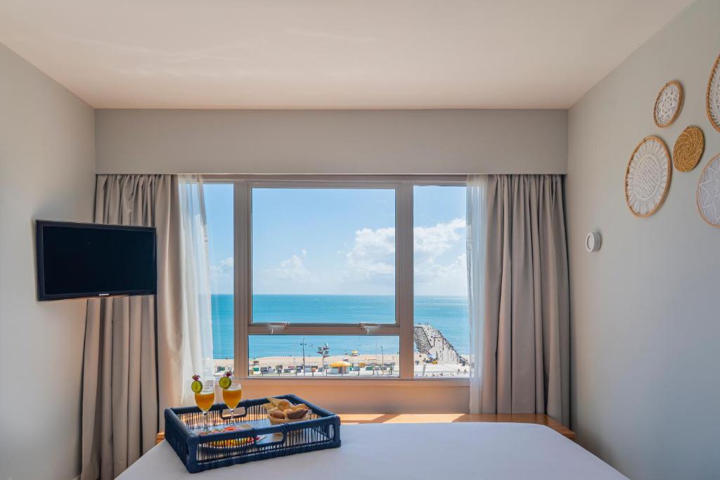 TV a/nebo společenská místnost v ubytování Praiano Hotel