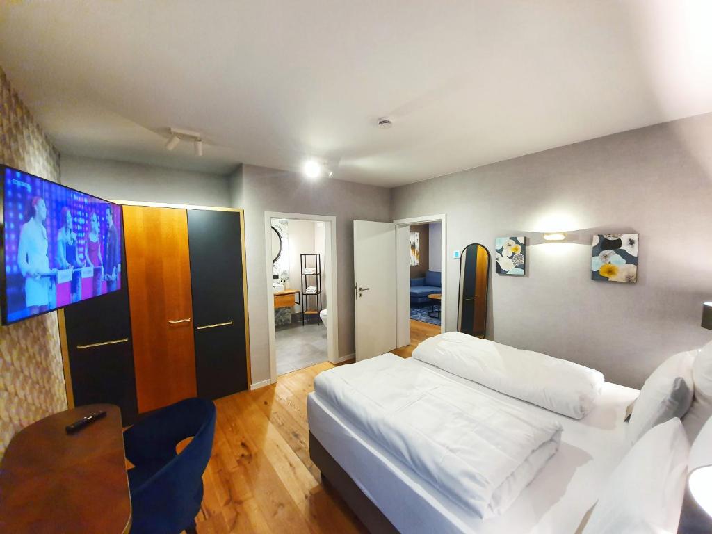 Postel nebo postele na pokoji v ubytování Erasmus Lodge - Ferienwohnungen zum Wohlfühlen