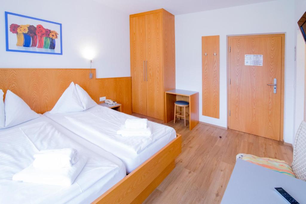 Postel nebo postele na pokoji v ubytování Hotel Gabriel