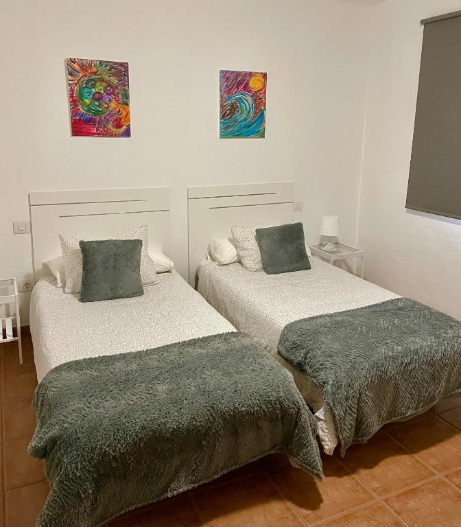Posteľ alebo postele v izbe v ubytovaní Apartamento los Rostros