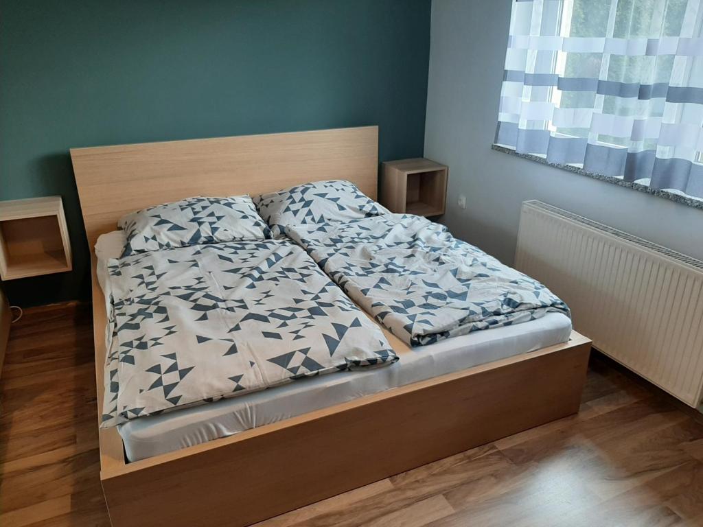 Postel nebo postele na pokoji v ubytování Zoli Vendégház