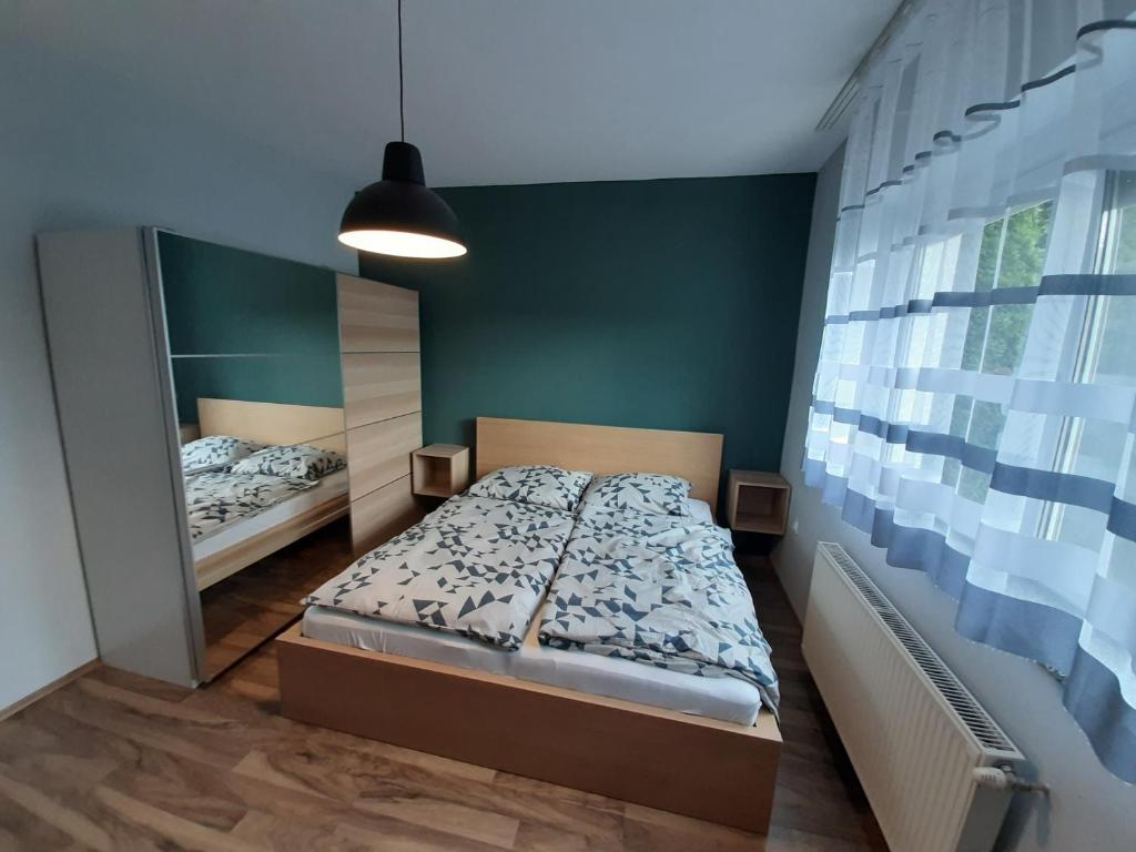 Postel nebo postele na pokoji v ubytování Zoli Vendégház