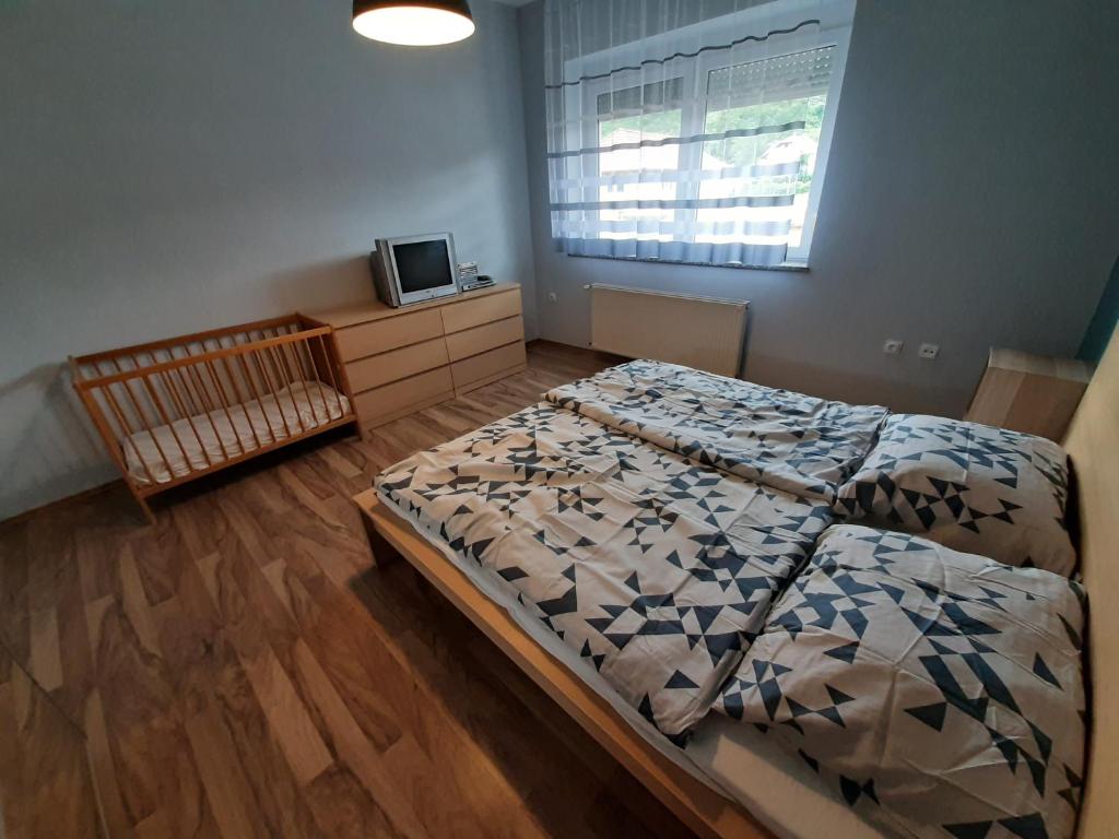 Postel nebo postele na pokoji v ubytování Zoli Vendégház