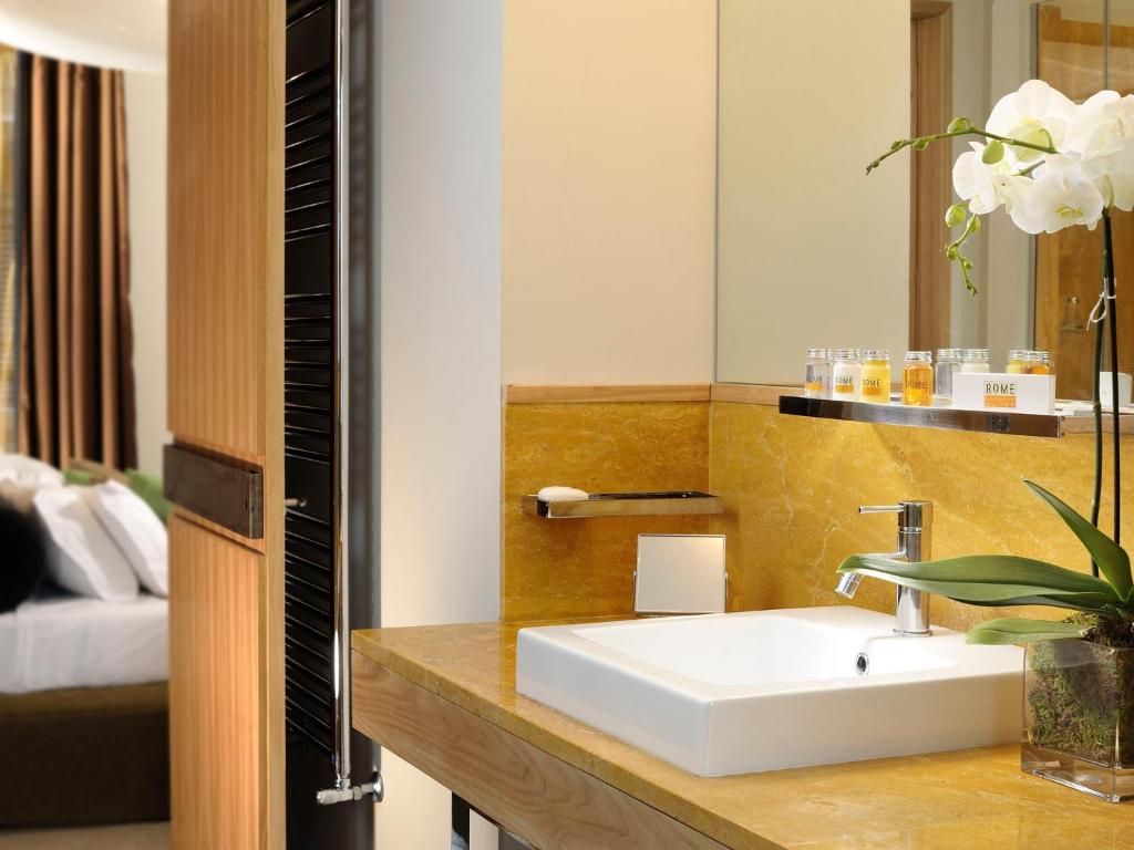 A bed or beds in a room at Babuino 181 - Small Luxury Hotels of the World