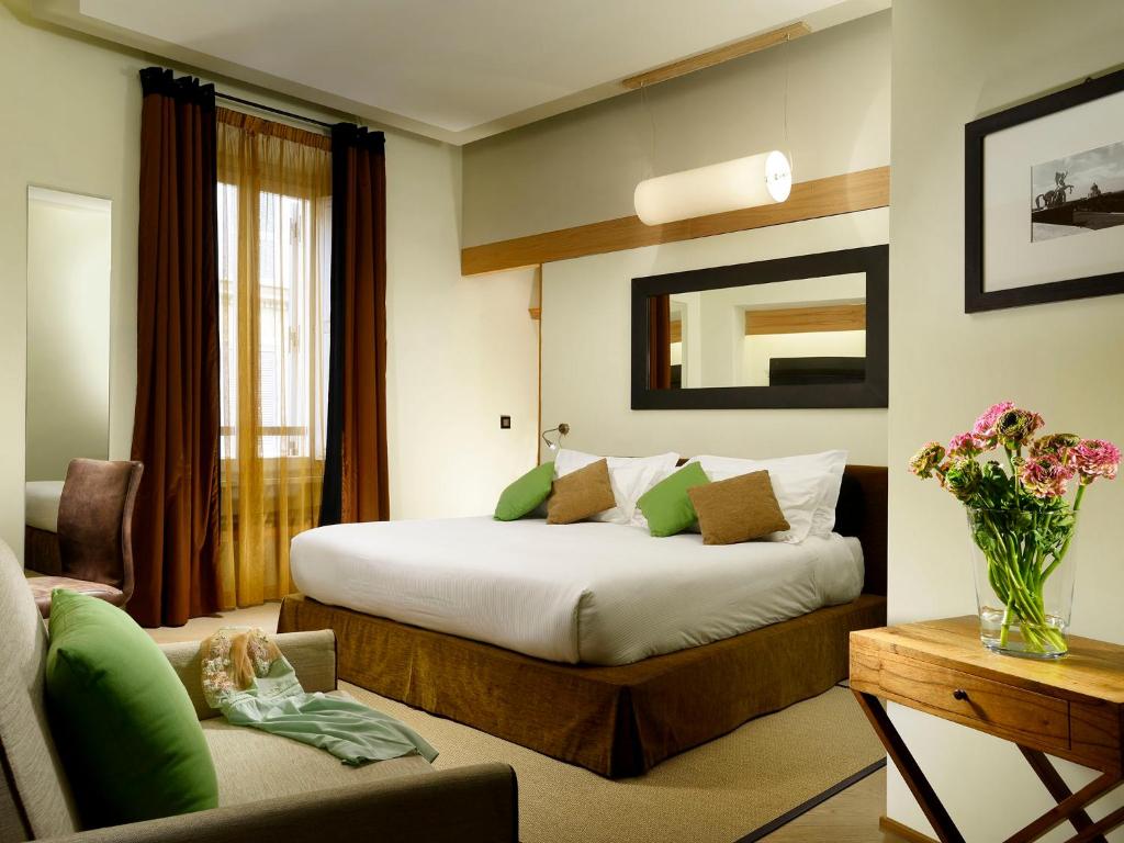 A bed or beds in a room at Babuino 181 - Small Luxury Hotels of the World