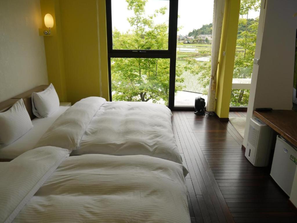 Postel nebo postele na pokoji v ubytování Aqua Star Villa Homestay