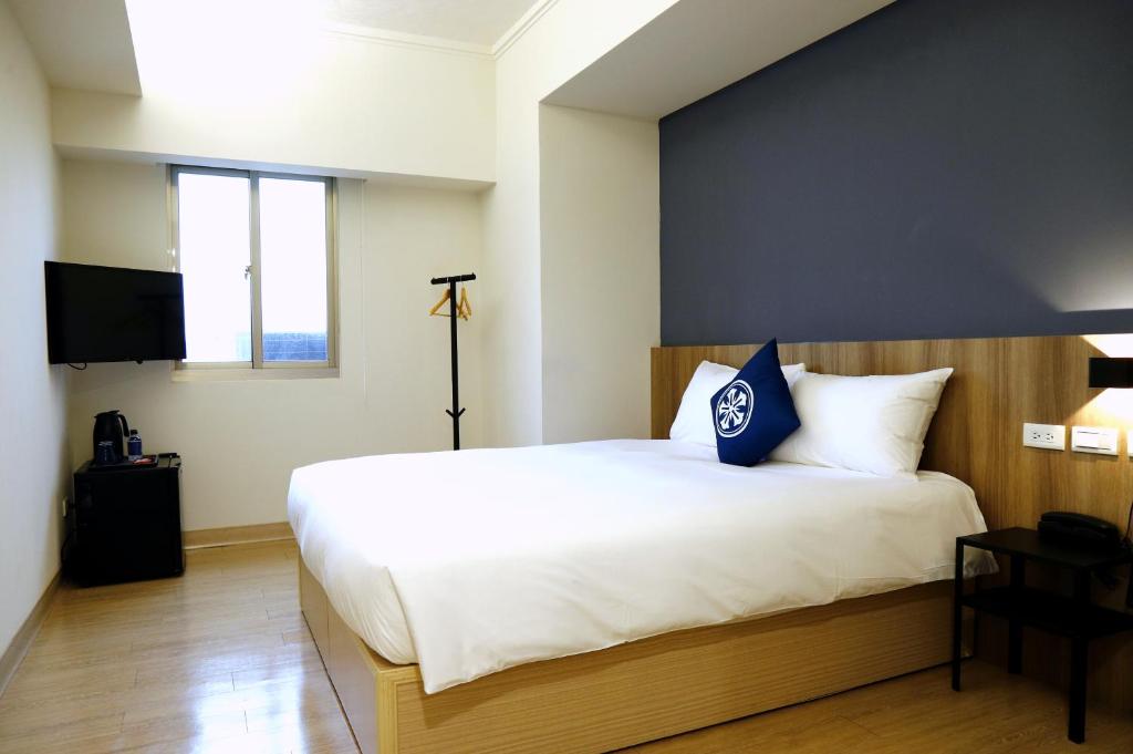 Postel nebo postele na pokoji v ubytování Holo Hotel Tainan