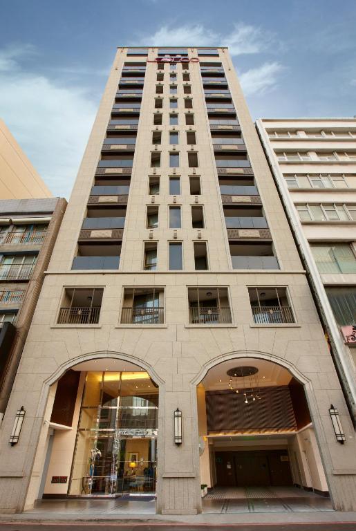 a tall building with two arches in front of it at Leofoo Residences in Taipei