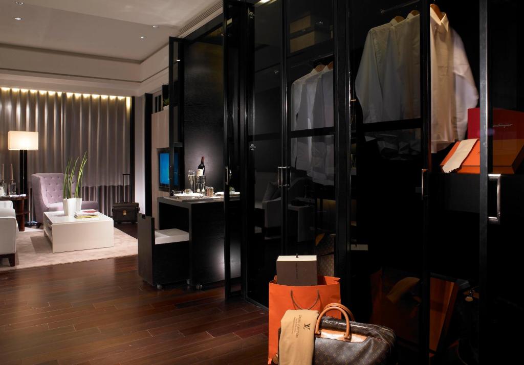 a living room with a room with a dresser and a room with a room at Leofoo Residences in Taipei