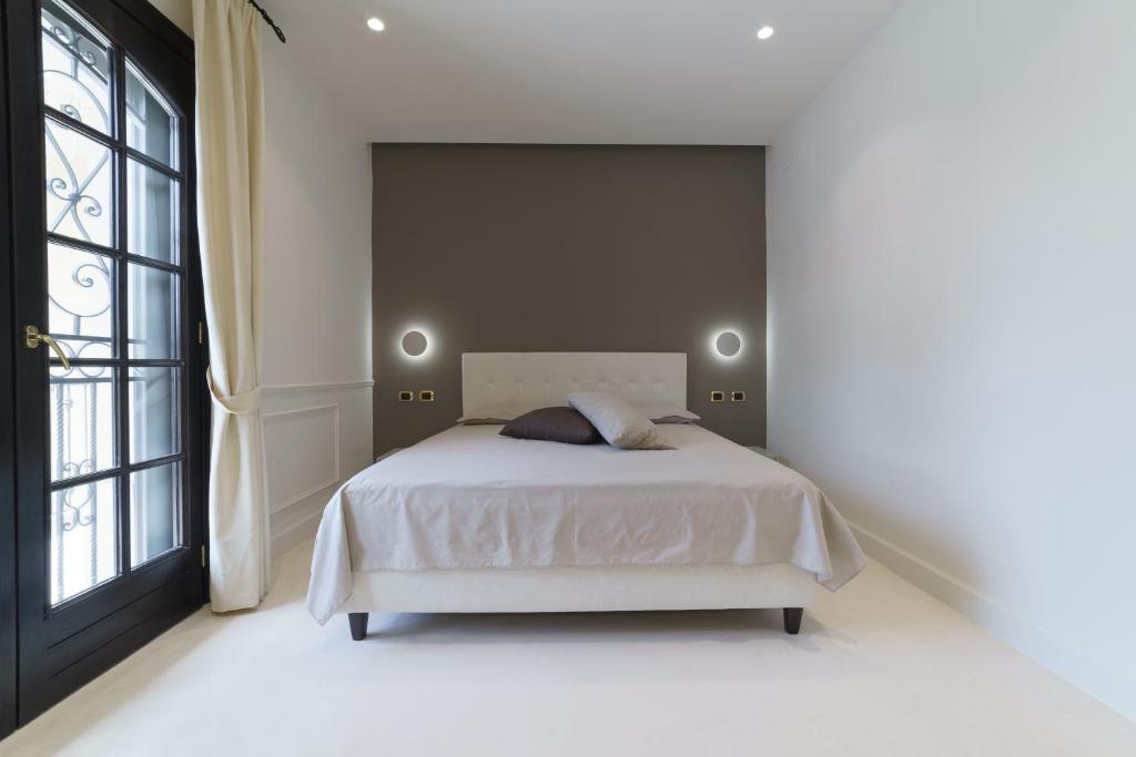 Postel nebo postele na pokoji v ubytování Caffetteria Luca Suite & Rooms