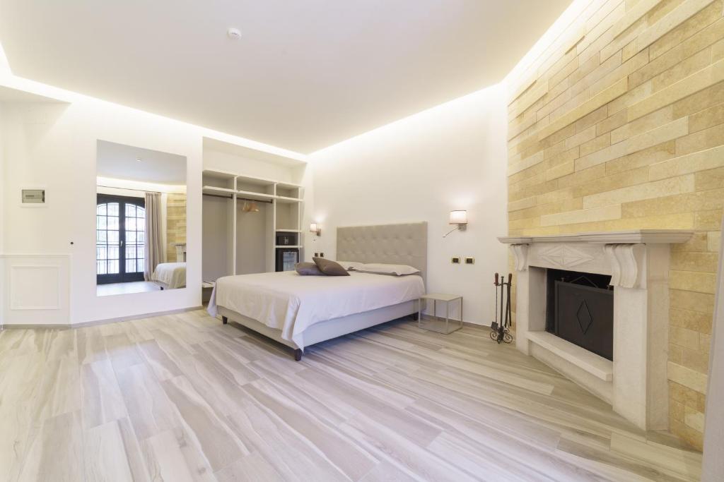 Postel nebo postele na pokoji v ubytování Caffetteria Luca Suite & Rooms