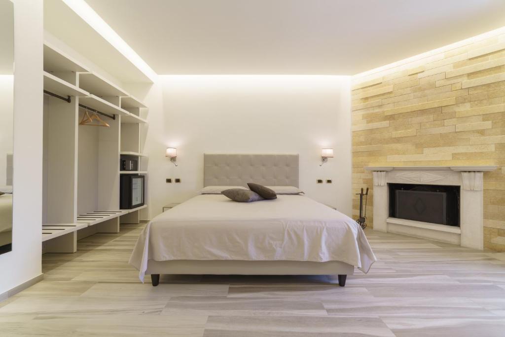 Postel nebo postele na pokoji v ubytování Caffetteria Luca Suite & Rooms