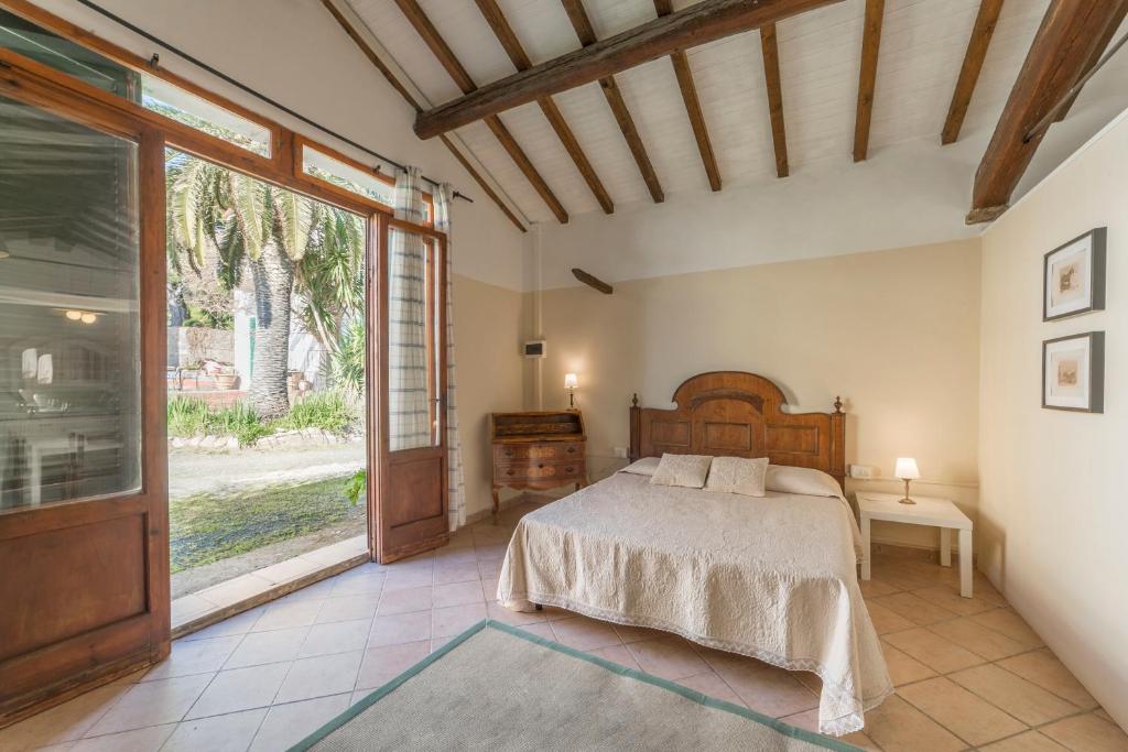 Postel nebo postele na pokoji v ubytování Agriturismo SS Annunziata